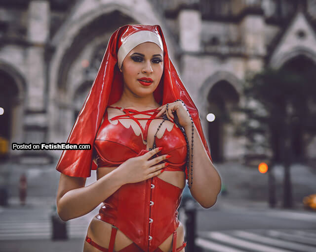 Ashley Bad dressed in red latex nun outfit