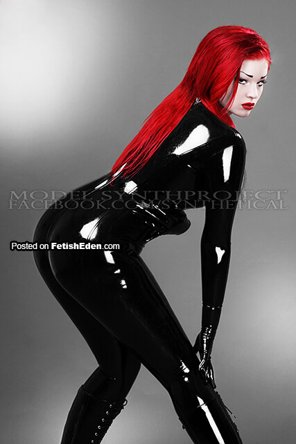 SynthProject lady with red hair in black latex catsuit