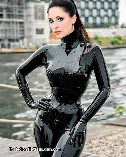 Kay Morgan sexy babe in black latex catsuit, black latex gloves and black latex corset brunette beauty Kay Morgan in black latex catsuit