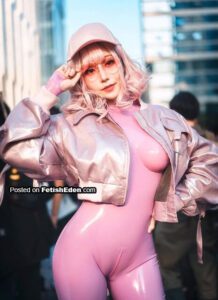 Asian girl outdoors in pink latex catsuit and pink jacket
