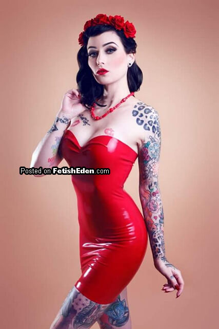 A strapless red latex mini-dress gathers roses, ink, and beautifully dangerous distractions
